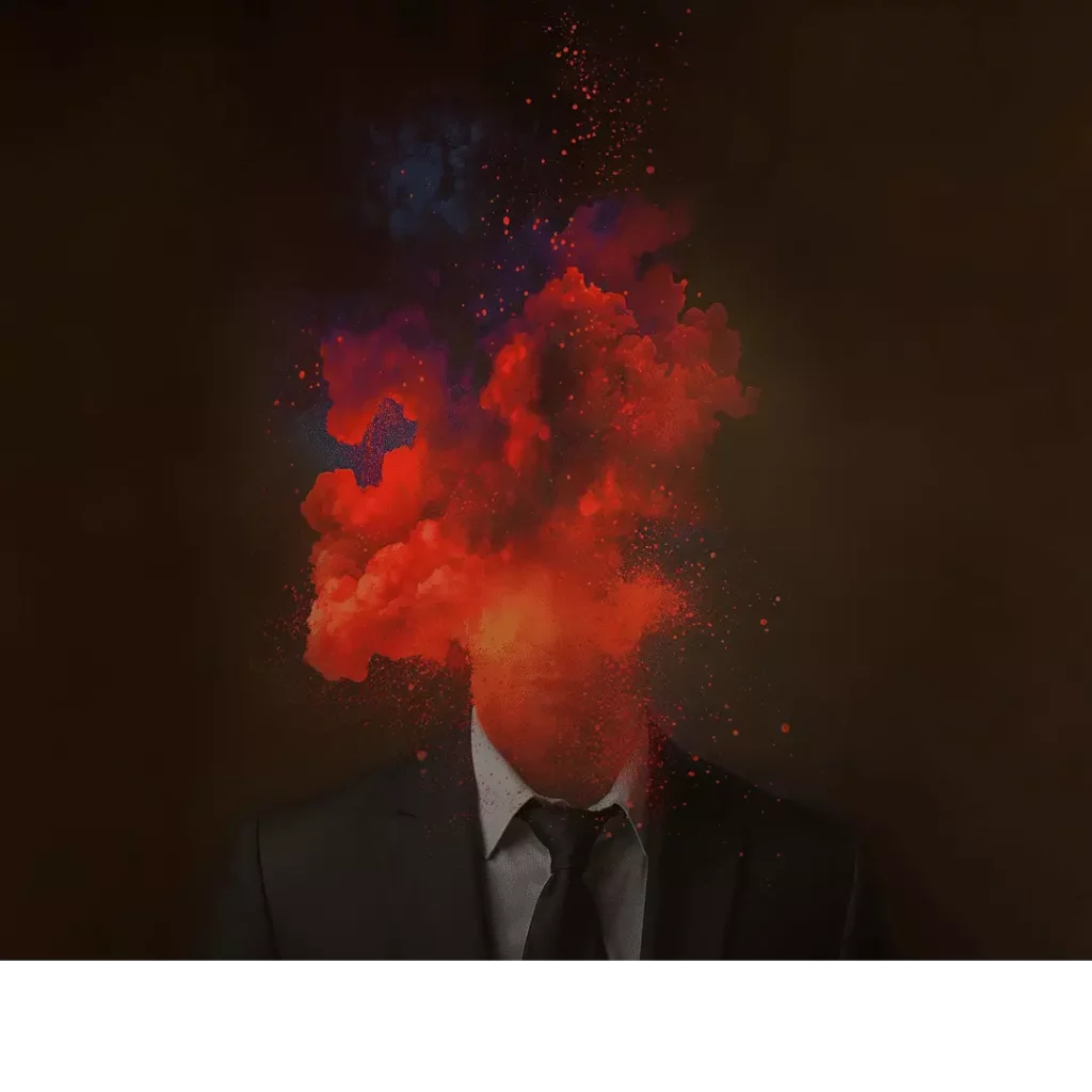 Image d'en-tête de l'article Je Réalise : " Canaliser la colère et l’exprimer sainement ", sur laquelle l'on voit un homme en costume dont la tête a explosé et brûle (fumée rouge et bleue).